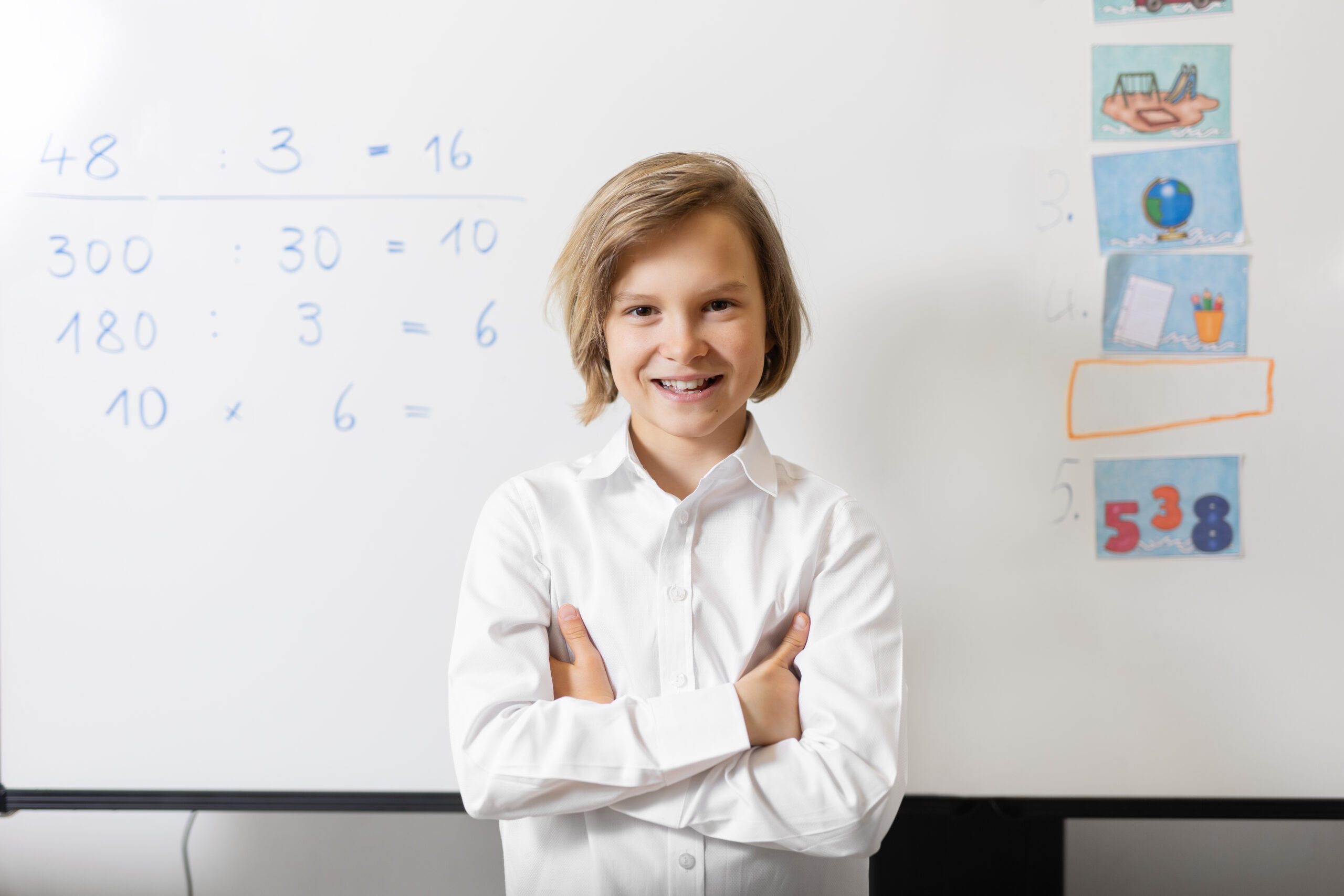 Confident child in front of math problems after building ADHD math strategies and school confidence