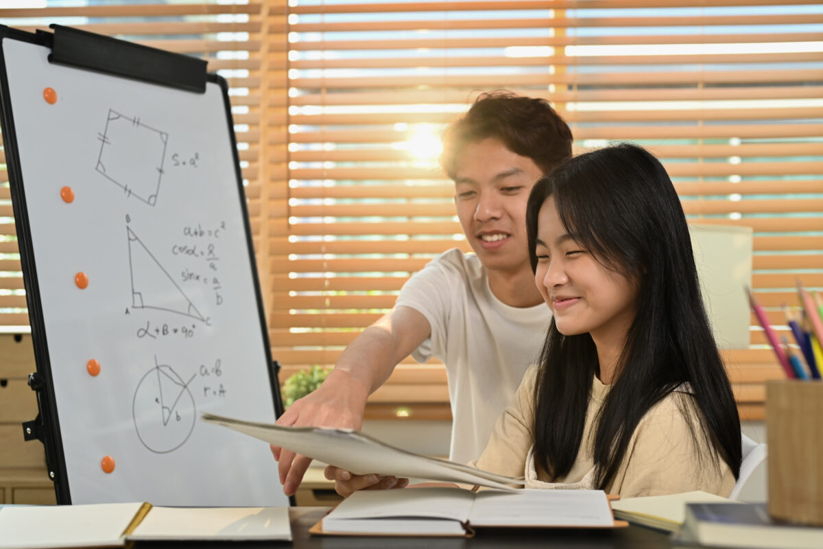 Teen student receiving ADHD math tutoring support with geometry homework at home