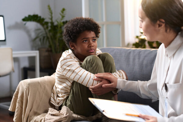 Child speaking with a therapist about ADHD assessment and school support in Mississauga, Brampton, Milton and Oakville